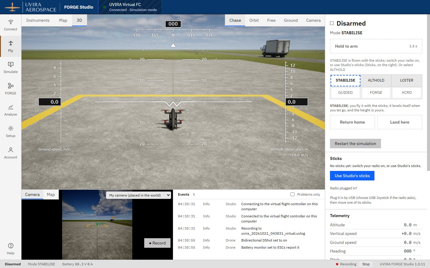The Fly screen with the 3D view in Chase, the QC-02 on the apron, the arm button and flight modes on the right, the camera picture and Events below