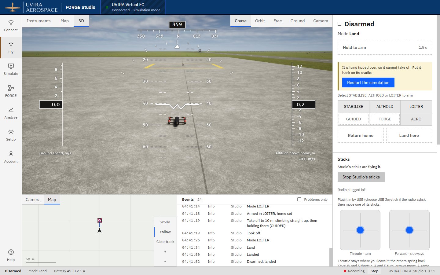 The QC-02 landed away from its launcher and lying on its belly, with Studio's message It is lying tipped over and the Restart the simulation button